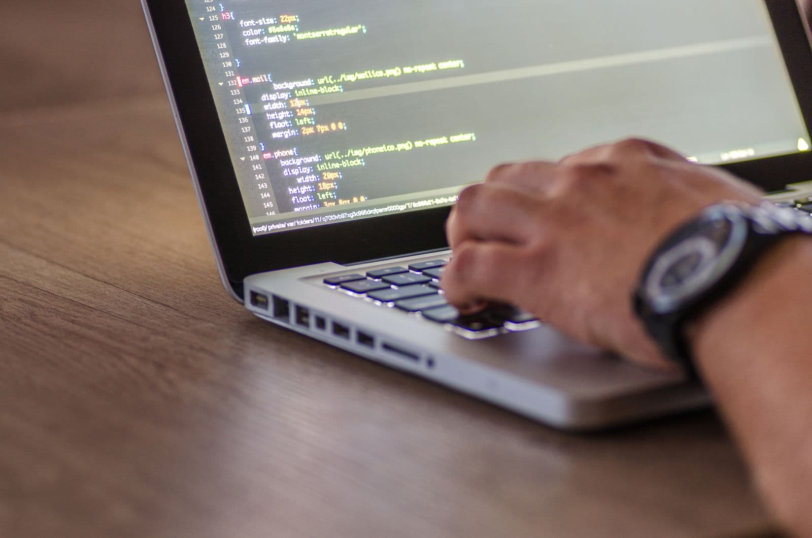 Developer building a custom CRM pipeline on a laptop