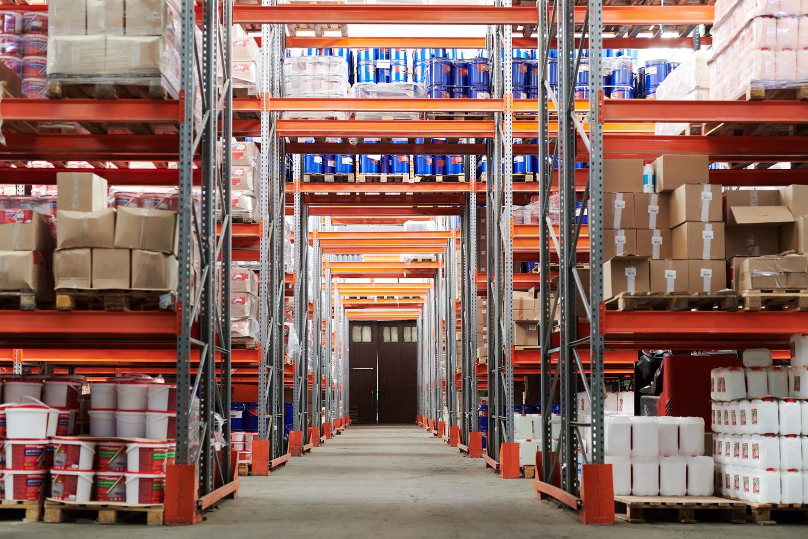 Warehouse packing table with cartons ready for courier pickup