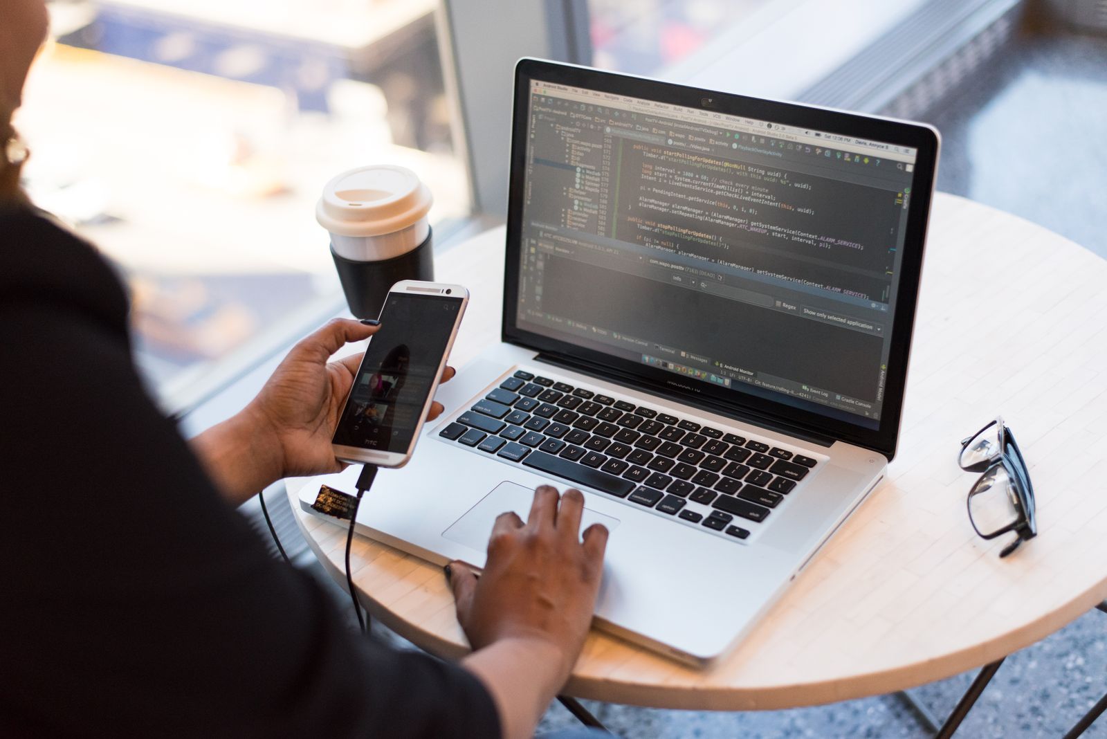 Developer working on a web application on a laptop