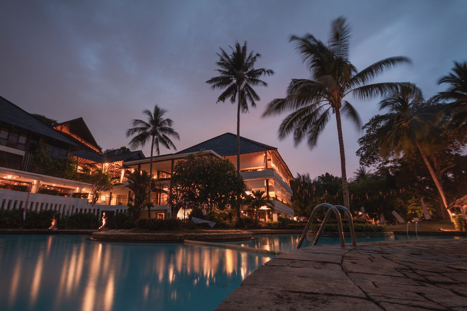 Hotel pool and building — a direct booking channel you own