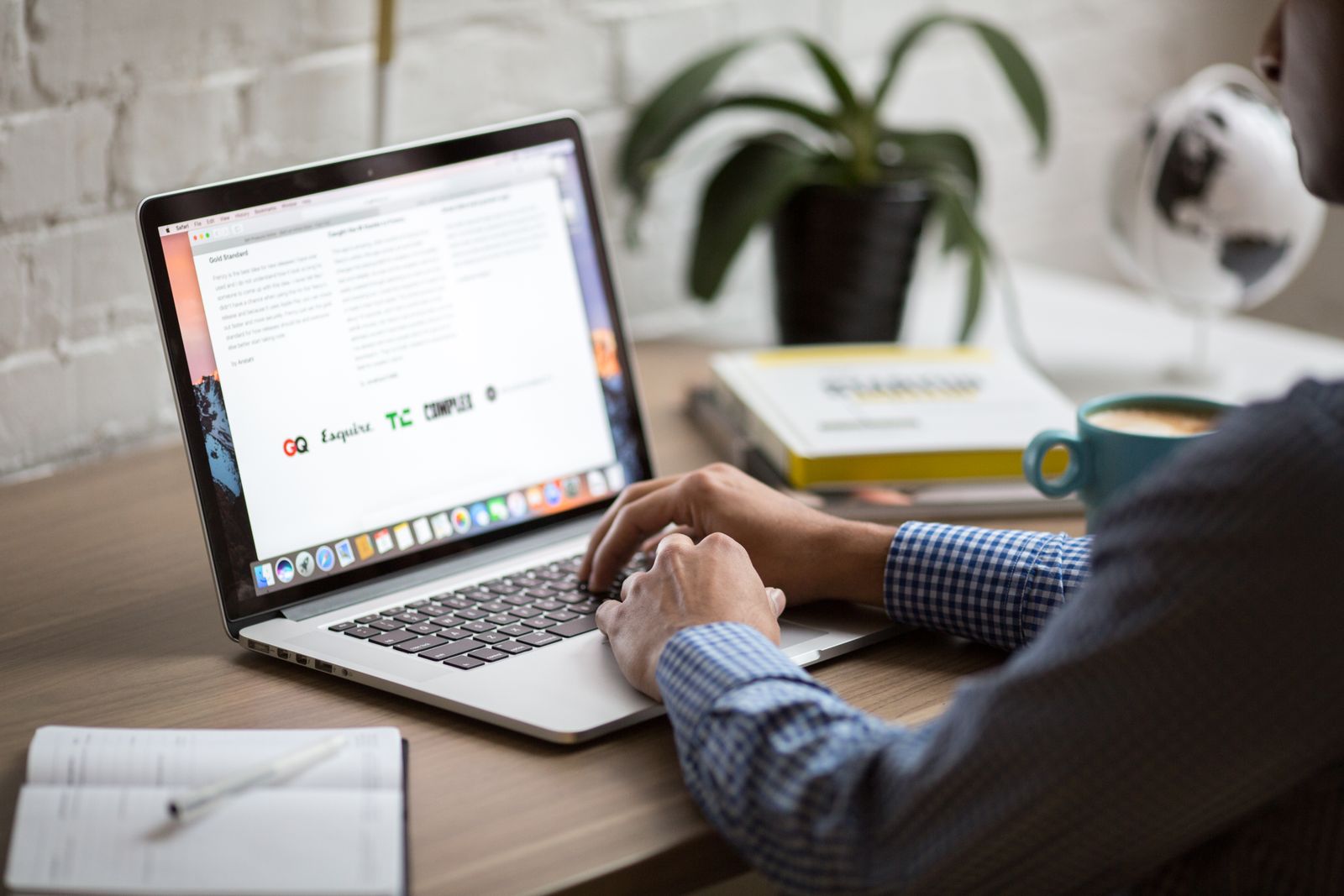 Laptop on a desk — choosing a site versus a logged-in app